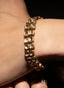 Rose cut diamond double strand bracelet in 22K yellow gold on model's wrist, showing relative size.