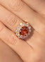 Close-up of pink tourmaline and diamond ring, showcasing intricate details.