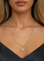 The Genesis Medallion in 14K gold, worn on a necklace, expressing support for Israel.