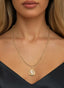 The Advocate Medallion in gold, worn on a necklace, representing God's supernatural help.