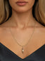 Be Healed gold Medallion, worn on a necklace, expressing faith-inspired beauty and healing.