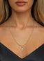 The Finisher Medallion (Small) in gold, on a necklace, representing faith, redemption, and love.