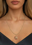 Roots & Branches Medallion in 14K gold, worn on a necklace, expressing unity and divine grace.