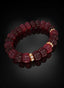 Ruby Abundant Seed Bracelet angled on black surface.