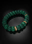 Emerald Beryl Abundant Seed Bracelet angled on black surface.