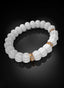 White Opal Abundant Seed Bracelet angled on black surface.