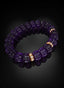 Amethyst and gold Abundant Seed Bracelet angled on black backdrop.