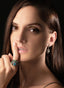 Model wearing aquamarine, emerald & diamond ring, showing its size, proportions and beauty.
