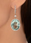 Close up of 39.43 ct aquamarine and diamond drop earrings in 18K gold, showcasing gemstone beauty.