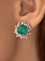 Close up of 5.26 emerald and diamond earrings in 18K white gold, showcasing beautiful emeralds.