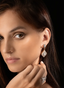 Model wearing rose cut diamond large drop earrings, displaying size, proportion, and elegance.