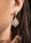 Close-up of rose cut diamond large drop earrings, showcasing craftsmanship and antique finish.