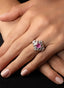 Model wearing pink sapphire and diamond baguette ring, displaying size, proportion, and elegance.