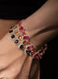 Model wearing sapphire and diamond bracelets, highlighting elegance, size, and gemstone brilliance.