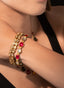 Model wearing ruby and rose cut diamond bracelet, highlighting its beauty and fine details.
