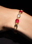 Close-up of ruby and rose cut diamond bracelet, showcasing craftsmanship and gemstone beauty.