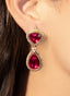 Close-up of pink tourmaline and diamond drop earrings, showcasing gemstone brilliance..