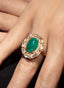 Close-up of 6.52 ct emerald and rose-cut diamond ring on model's hand, showing fine craftsmanship.