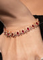 Close-up of rubellite and rose cut diamond bracelet, highlighting gemstone brilliance.