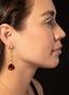 Model wearing rhodolite and diamond drop earrings, displaying size, proportion, and elegance.