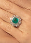 Close-up of emerald and diamond ring, displaying size, proportion, and elegance.