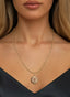 4:14 Medallion in 14K gold, worn on a necklace, showcasing the beauty of devotion.