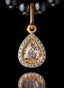 Tears of Joy Medallion in 14K gold with rose cut center diamond and teardrop shape.