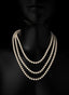 Gold freshwater pearl necklace in triple loop, inspired by Matthew 13:45.
