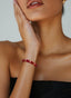 Ruby Abundant Seed Bracelet shown on wrist for fit and elegance.