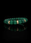 Side view of Abundant Seed Bracelet with emerald beryl and gold.