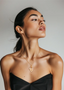 Woman wearing 18" INSPOCCO 14K gold link chain with INSPOCCO medallions.