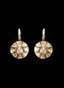 Close-up of rose cut diamond earrings with Victorian-style setting, highlighting diamond brilliance.