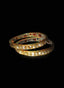 Close-up of rose cut diamond bangles, highlighting lovely antique finish and intricate enamel work.