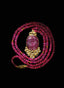 Close-up of ruby and white sapphire necklace, showcasing superb craftsmanship and hand-carved rubies