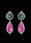 Close-up of emerald, pink tourmaline, and diamond drop earrings, showcasing craftsmanship.