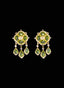 Close-up of peridot and diamond drop earrings on black background, highlighting gemstone brilliance.