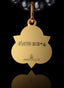 Back of The Advocate Medallion in gold, with Acts 2:2-4 embossed, signifying the Spirit’s presence.