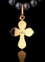 Back of The Finisher Medallion (Large) in gold, signifying God's radical redemptive love.